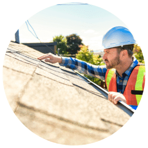 Roofer inspecting a residential roof